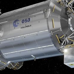 the module is cylindrical in shape attached to other cylindrical module. At the end of it there are multiple cuboid attachments, the clock being one of them.