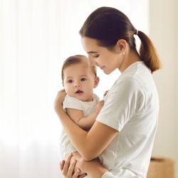 mother holding a baby