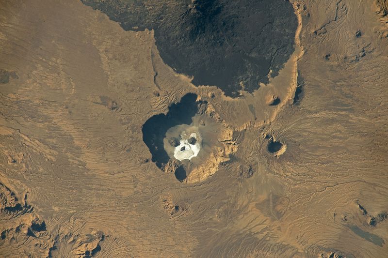 Image of salt formations in the Trou au Natron volcano caldera in northern Chad that look like a huge skull, take by an ISS astronaut on February 12, 2023.