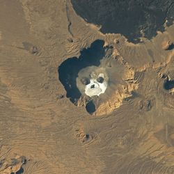 Image of salt formations in the Trou au Natron volcano caldera in northern Chad that look like a huge skull, take by an ISS astronaut on February 12, 2023.