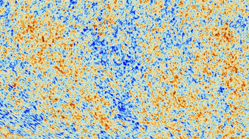 a portion of the cosmic microwave background. Grainy mixture of red and blue regions showing tiny difference in the temperature of the universe