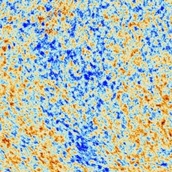 a portion of the cosmic microwave background. Grainy mixture of red and blue regions showing tiny difference in the temperature of the universe