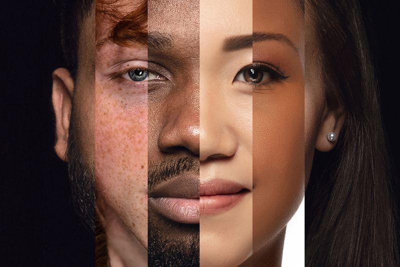 Human face made from different portrait of men and women of diverse age and race.