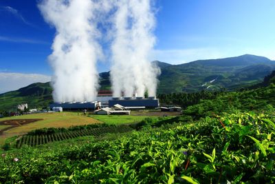 Geothermal power is electrical power generated from geothermal energy in a lush green landscape