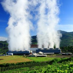Geothermal power is electrical power generated from geothermal energy in a lush green landscape