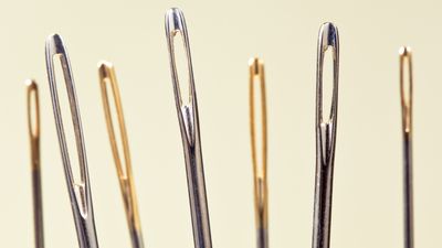 close-up of series of needles' eyes