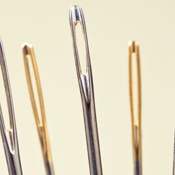 close-up of series of needles' eyes