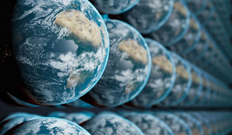 A view of the earth from space multiplied so there are rows and rows of Earths filling the whole image