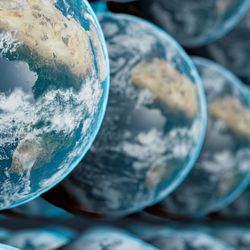 A view of the earth from space multiplied so there are rows and rows of Earths filling the whole image