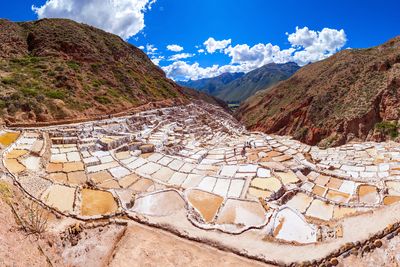 Aview of the salt mines, showing white, yellow and brown, as they cascade down the mountain.