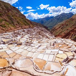 Aview of the salt mines, showing white, yellow and brown, as they cascade down the mountain.