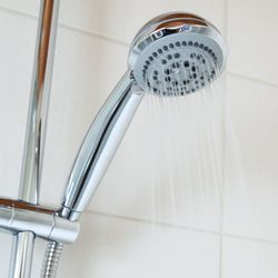 silver showerhead with running water