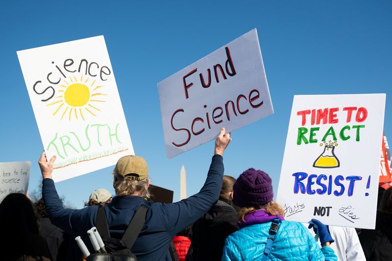 WASHINGTON DC USA - MARCH 7, 2025: Demonstrators gather at the Lincoln Memorial to protest the Trump administration’s cuts to scientific research and researchers in the “Stand Up for Science” rally