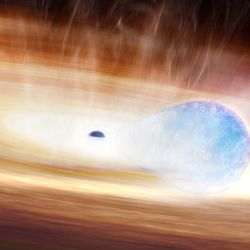 artost mpression of a small black hole ripping apart a star as they are both surrounded by a disk of material