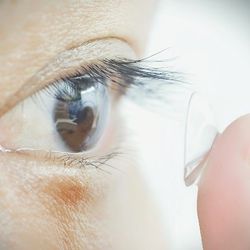 Study participant putting infrared contacts in their eye