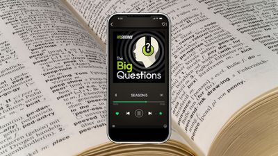 A phone showing season 5 of The Big Questions, on background of a close up photograph of an open dictionary