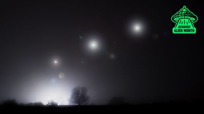 Three glowing orbs in the night sky