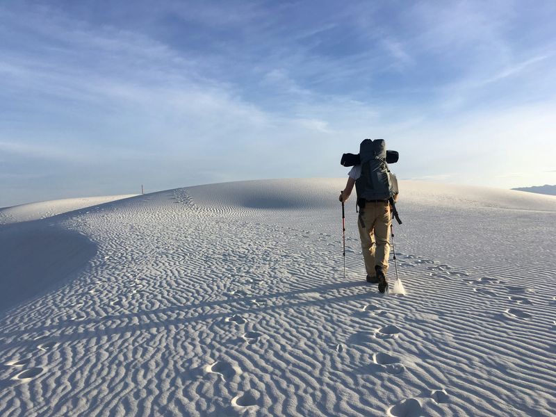 Backpacker on dunes