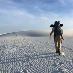 Backpacker on dunes