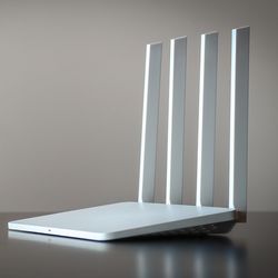 Wifi router standing on a clear table. 