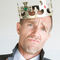 left to right: a male gray wolf; a cocky businessman wearing a plastic crown; a male orangutan