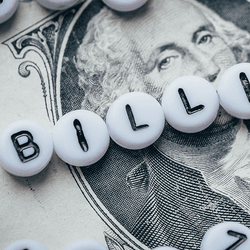 The word "billion" placed on top of a bank note.