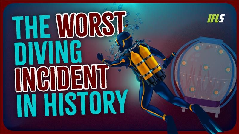 A diver swims next to a saturation chamber