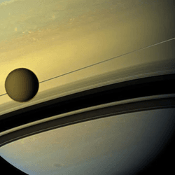 The Moon titan is seen in front of the planet and the rings are seen edge on, so they appear very thin.