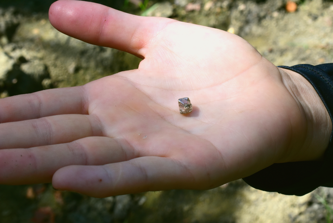 A 2.3 carat diamond in a woman's hand