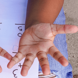 Girl counting on her fingers.