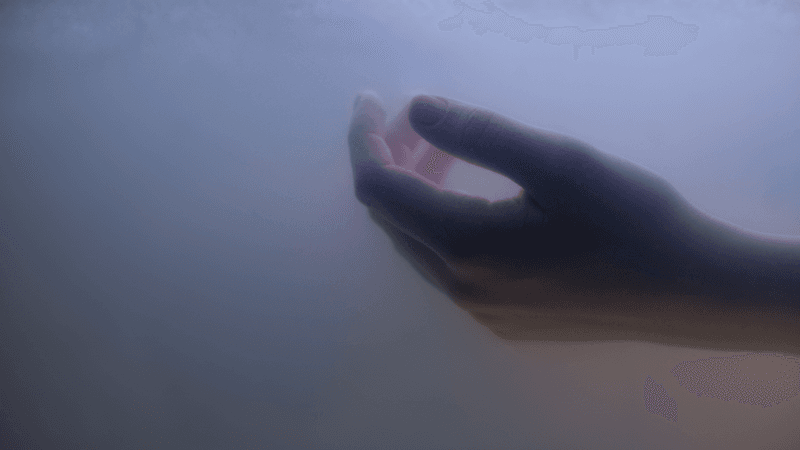a hand submerged in water