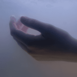 a hand submerged in water