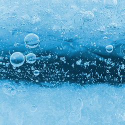 Bubbles of air underneath a layer of ice.