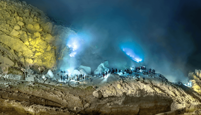 Tourists are the blue lava of Kawah Ijen volcano in East JAva, Indonesia