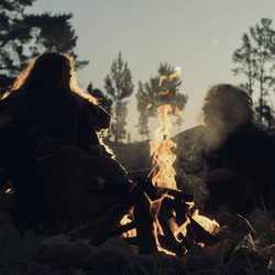 neanderthals gathered around a fire