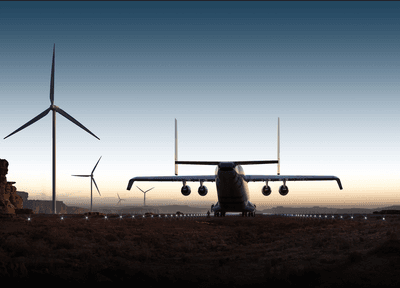 A rendering of the Windrunner aircraft driving into the sunset with windturbines.